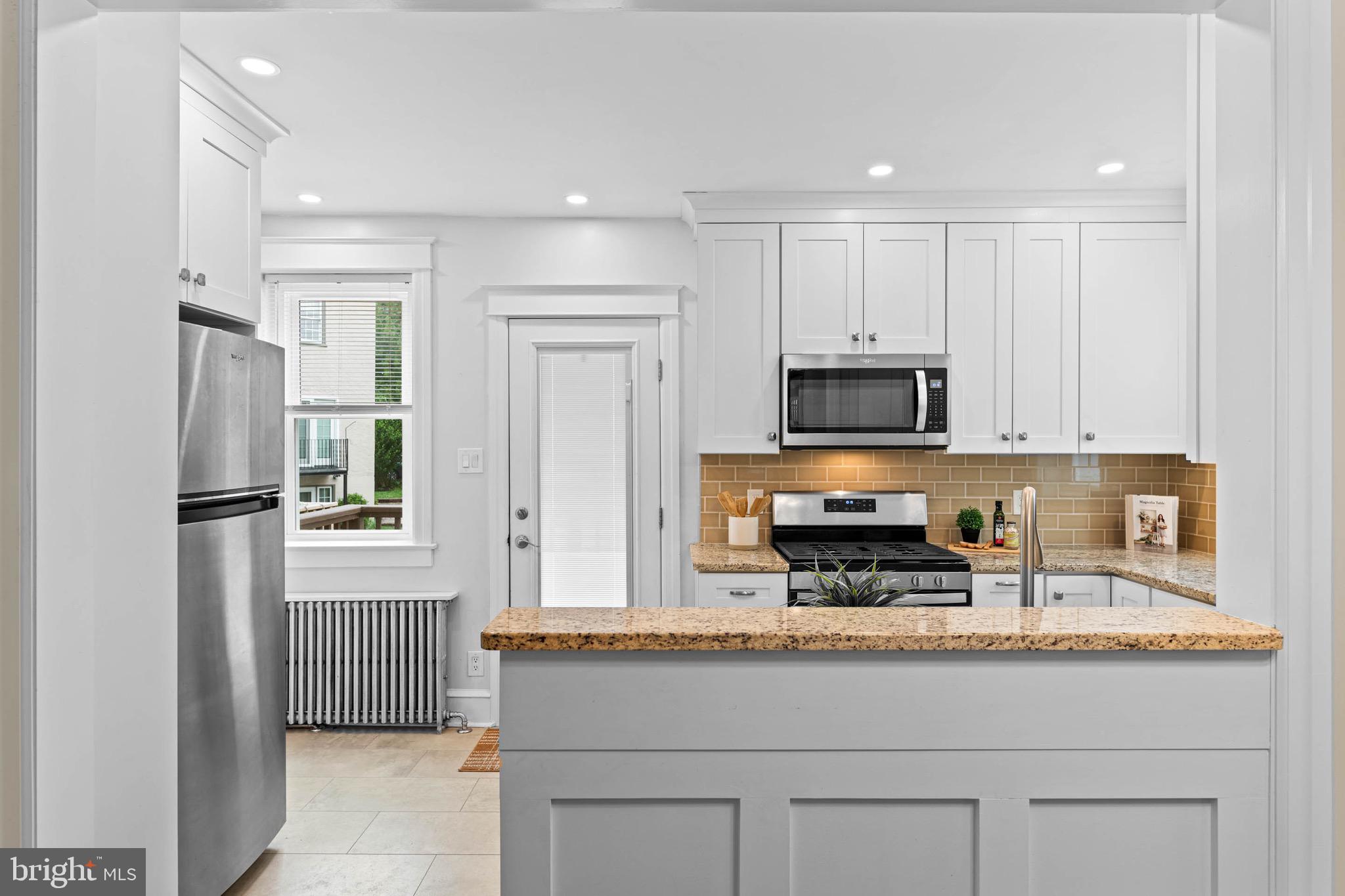32 Chatham Road Ardmore, PA 19003 - Photo 11 of 29 a kitchen with stainless steel appliances granite countertop a refrigerator and a stove top oven