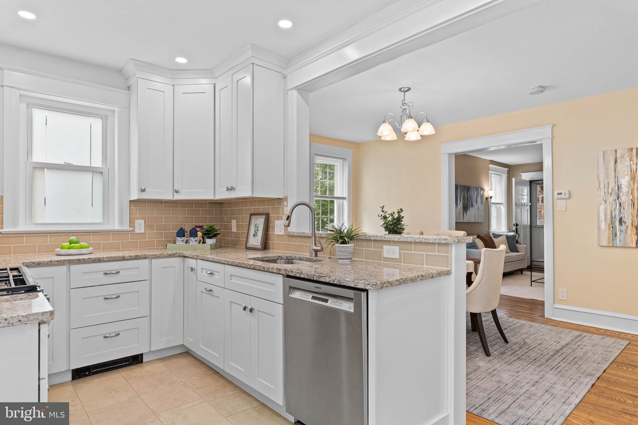 32 Chatham Road Ardmore, PA 19003 - Photo 16 of 29 a kitchen with a sink stove and cabinets