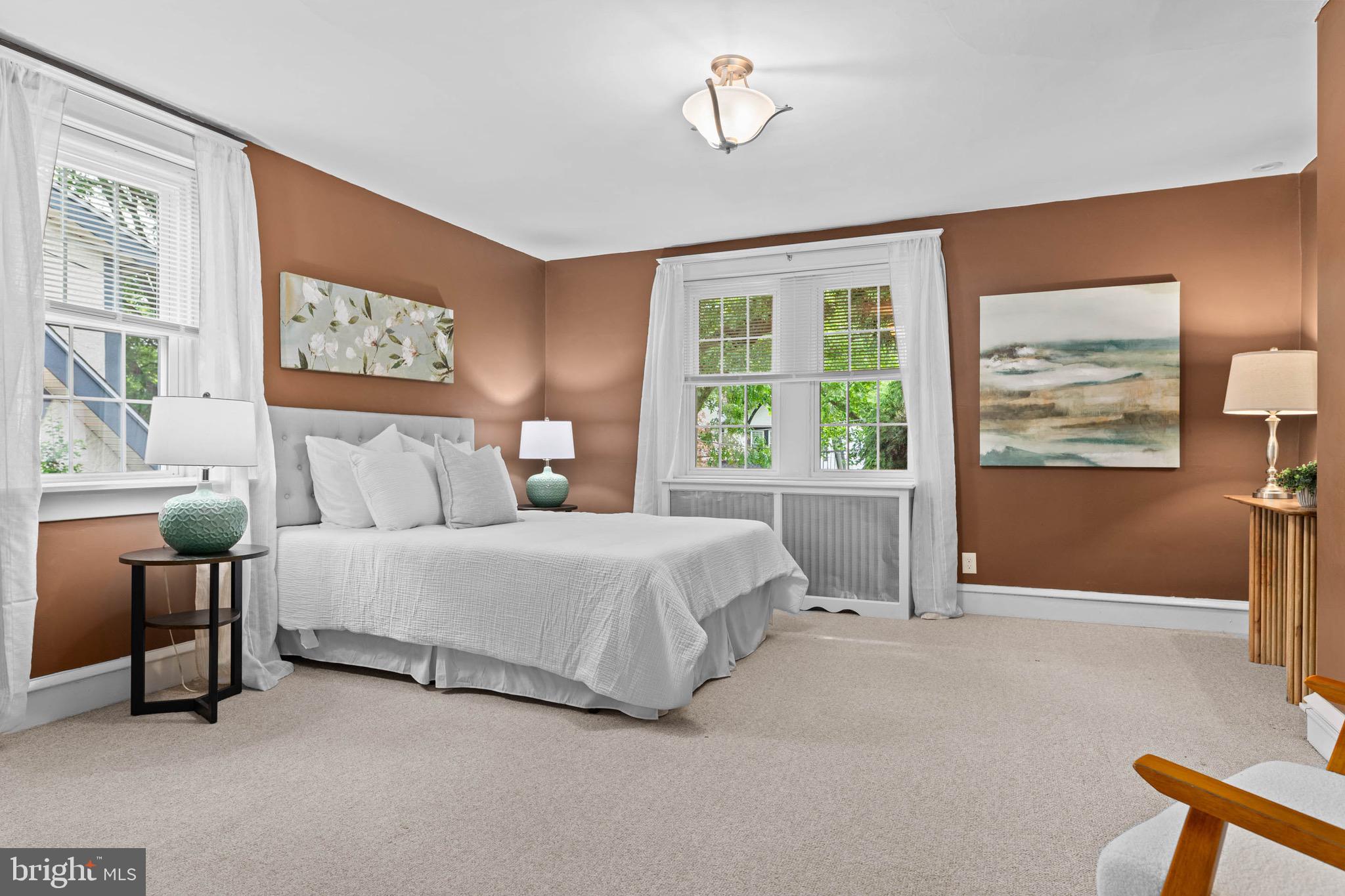 32 Chatham Road Ardmore, PA 19003 - Photo 18 of 29 a spacious bedroom with a bed and glass window