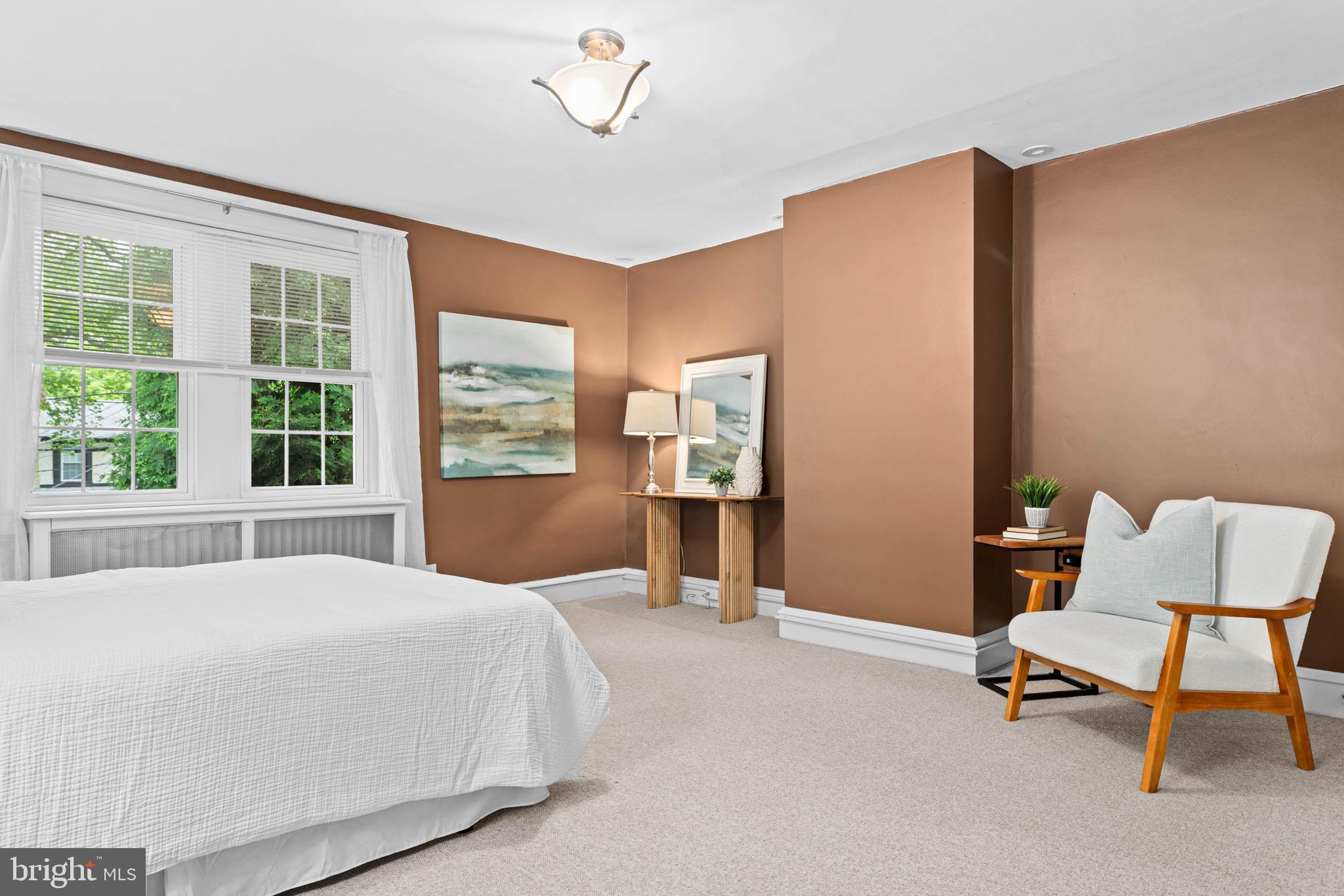 32 Chatham Road Ardmore, PA 19003 - Photo 19 of 29 a bedroom with a large bed and a chair