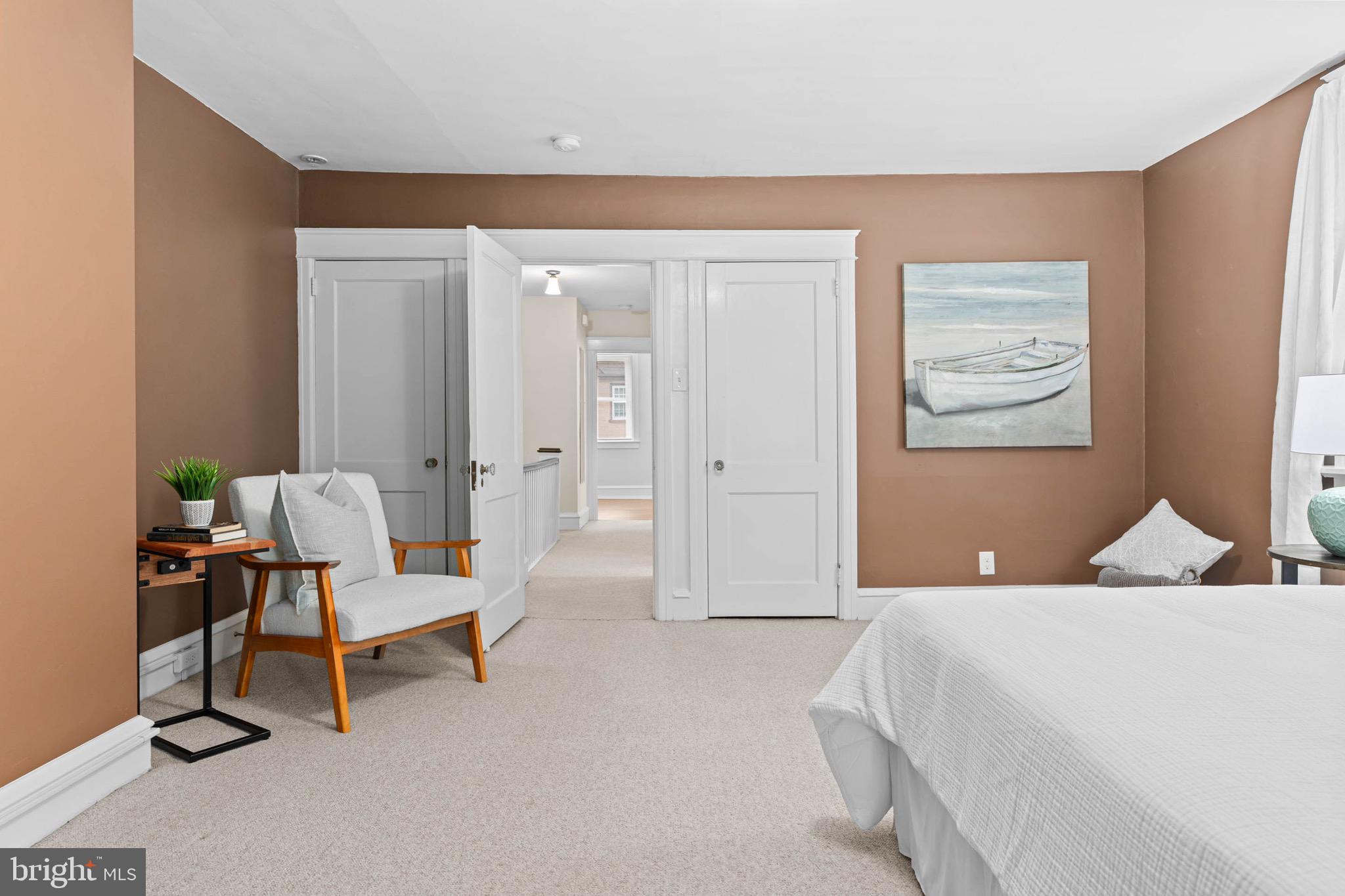 32 Chatham Road Ardmore, PA 19003 - Photo 20 of 29 a bedroom with a bed a chair and painting on the wall