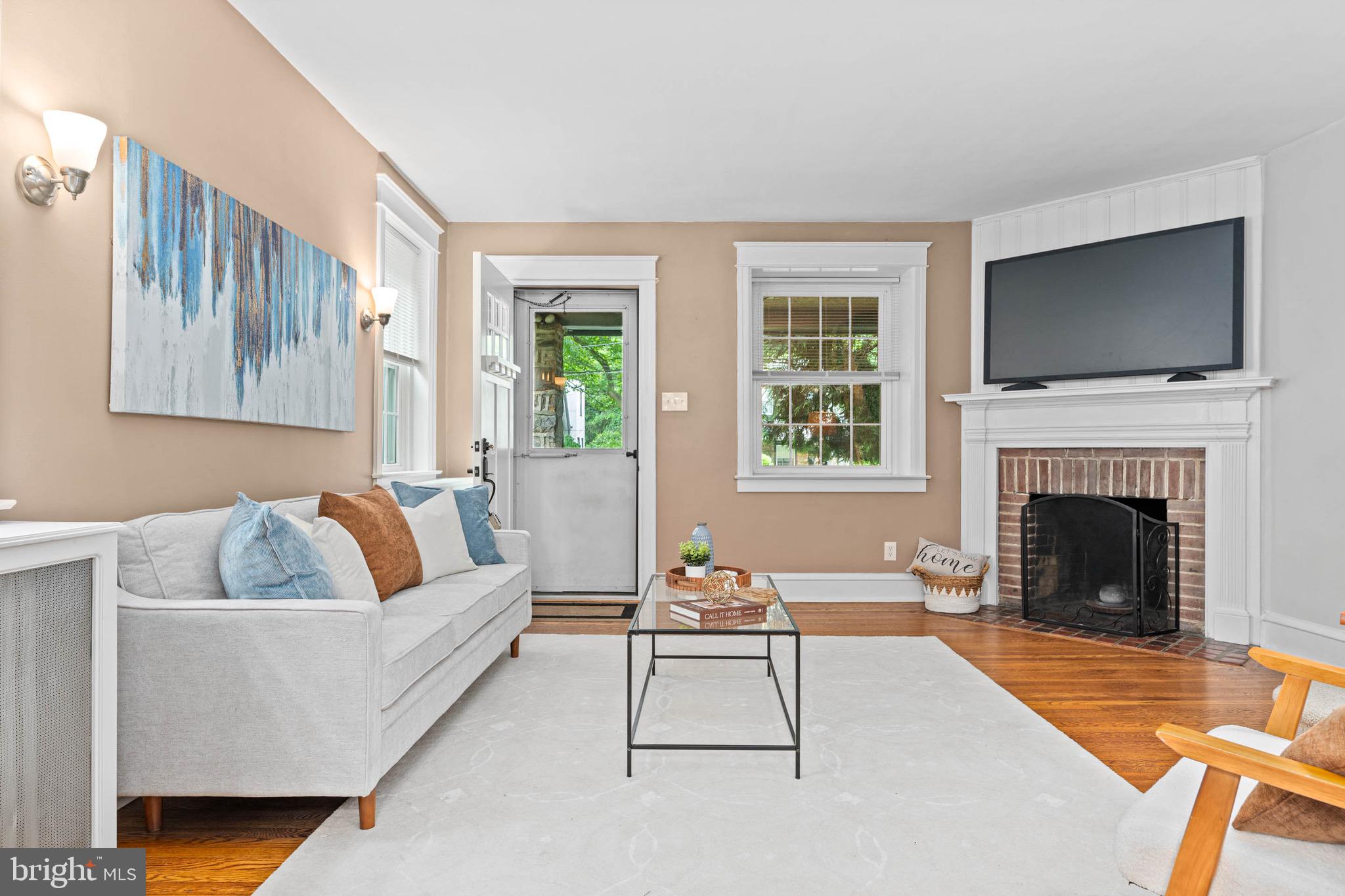 32 Chatham Road Ardmore, PA 19003 - Photo 6 of 29 a living room with furniture fireplace and flat screen tv