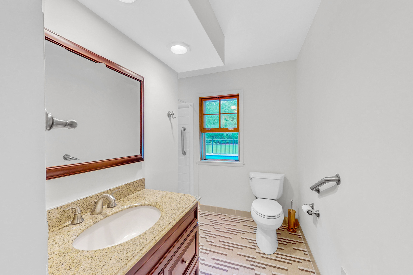 2100 Burr Oak Drive Glenview, IL 60025 - Photo 11 of 38 a bathroom with a granite countertop sink a toilet and a mirror