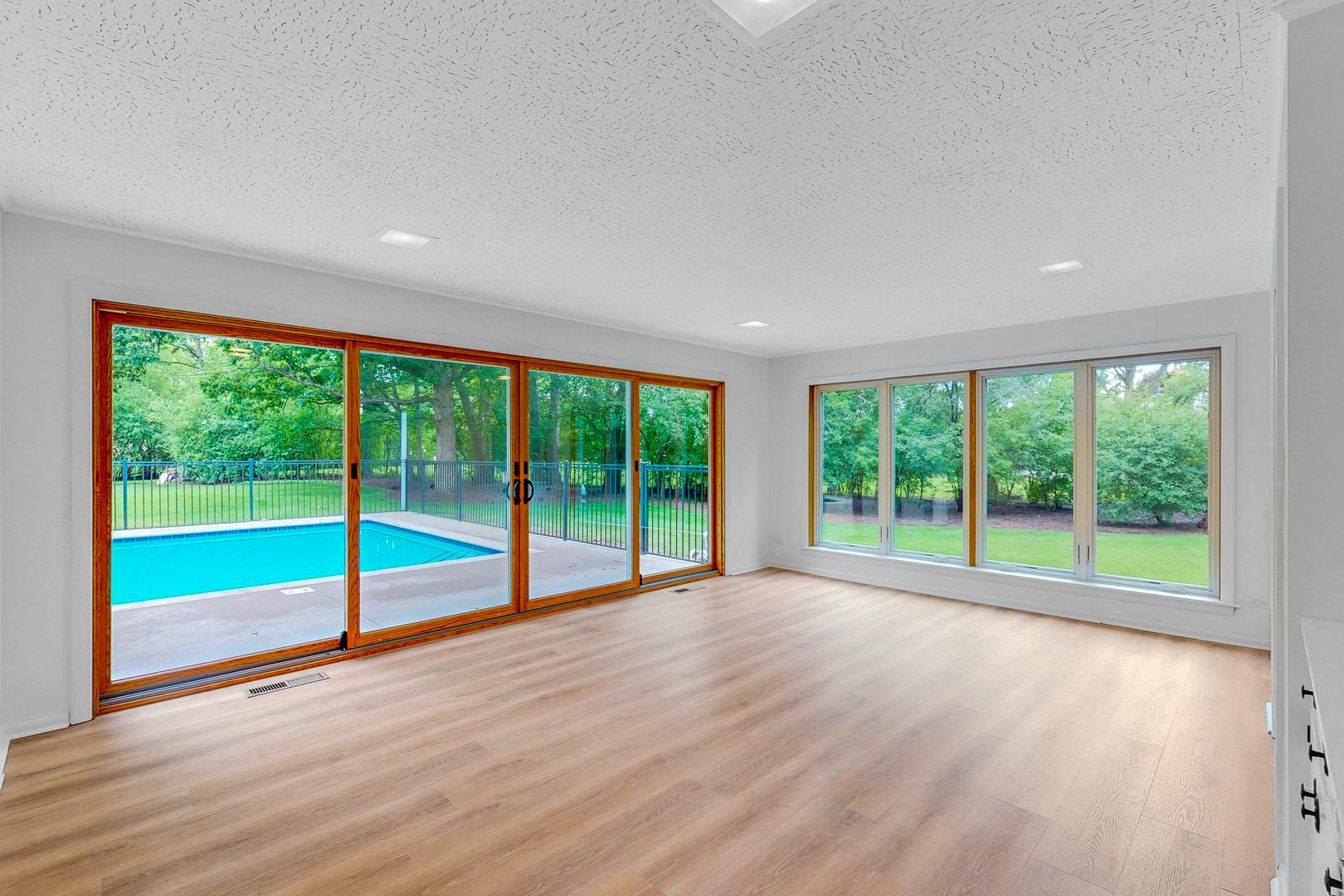 2100 Burr Oak Drive Glenview, IL 60025 - Photo 13 of 38 a view of an empty room with wooden floor and city view