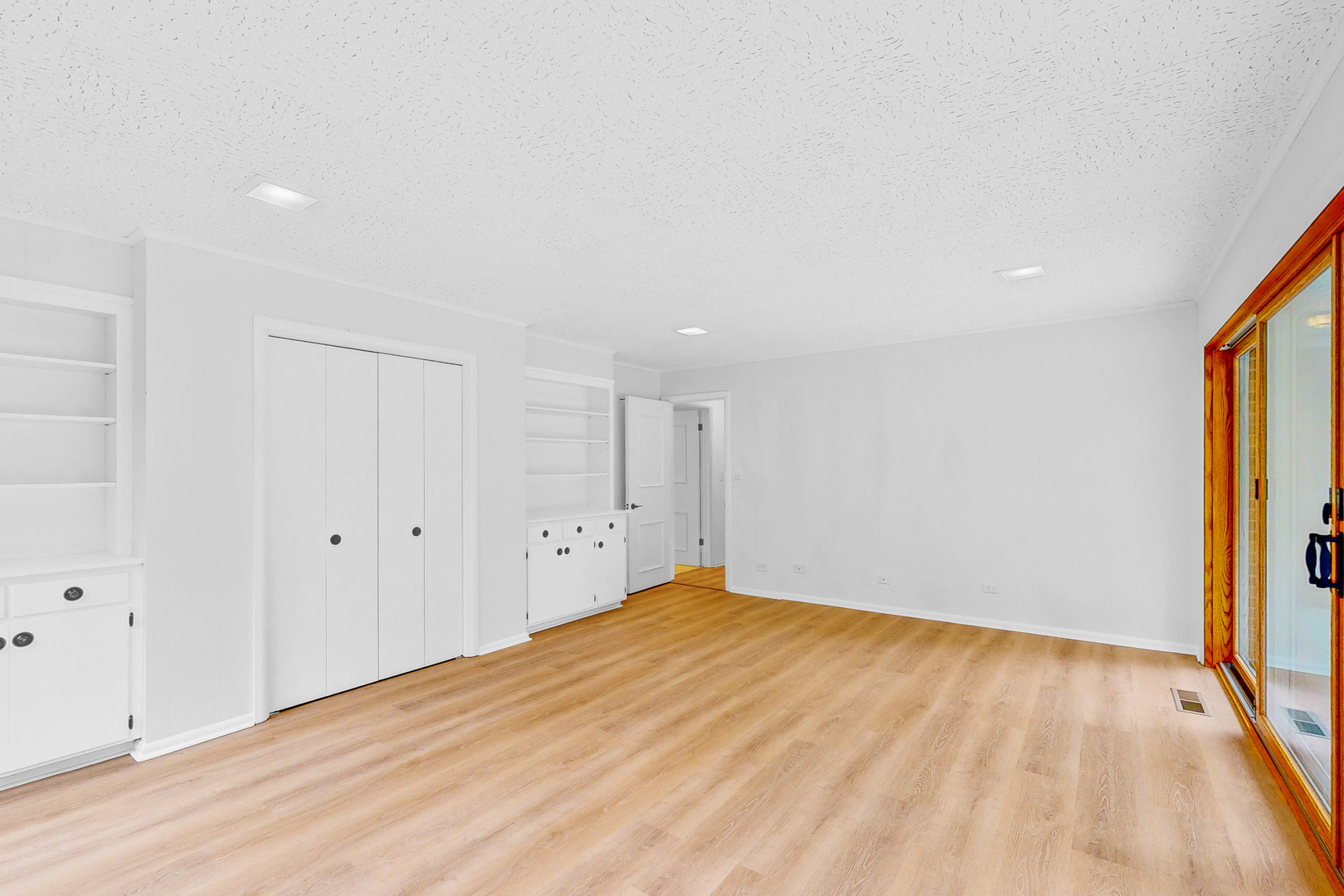 2100 Burr Oak Drive Glenview, IL 60025 - Photo 14 of 38 a view of empty room with wooden floor and fan