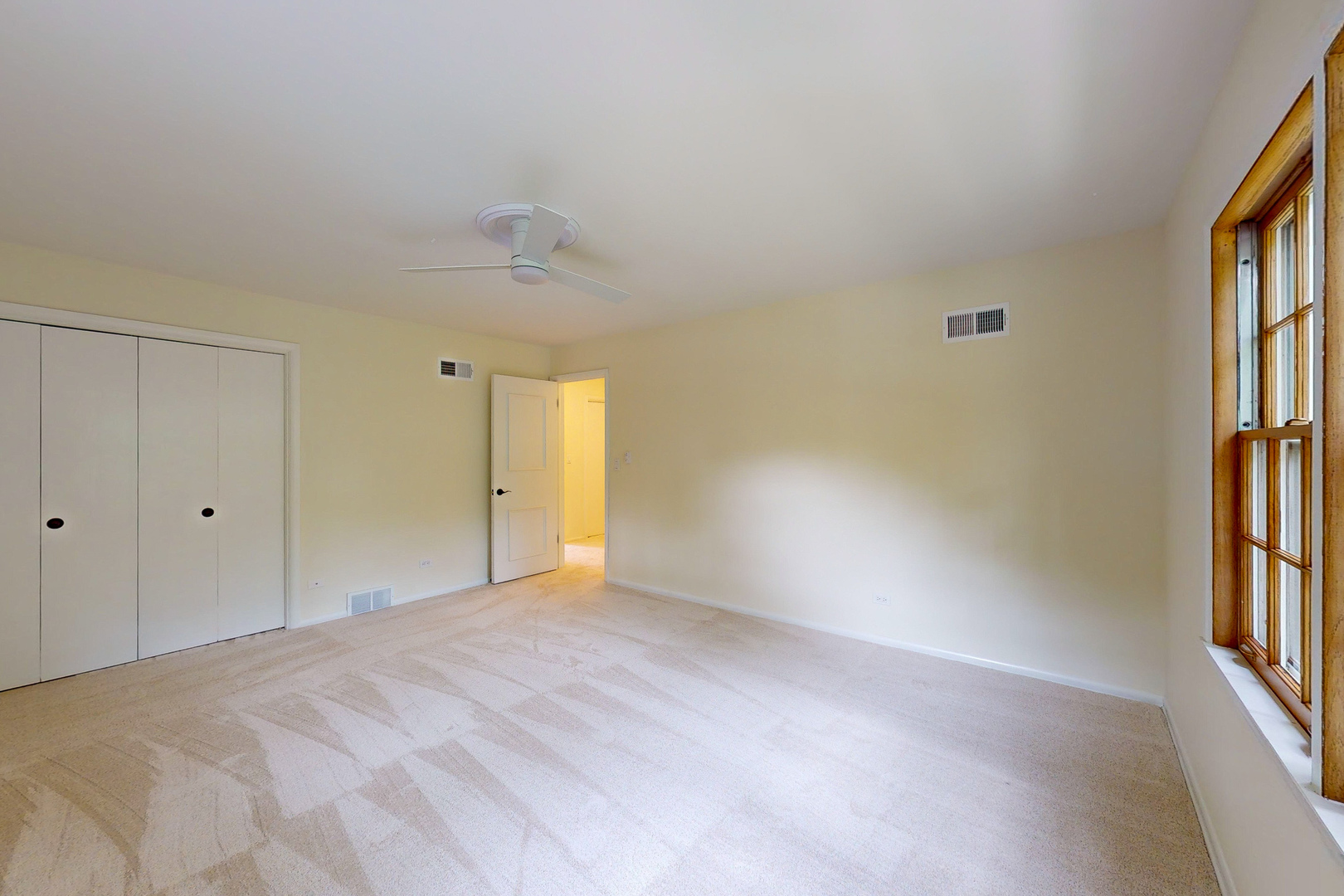 2100 Burr Oak Drive Glenview, IL 60025 - Photo 18 of 38 a view of an empty room with a window