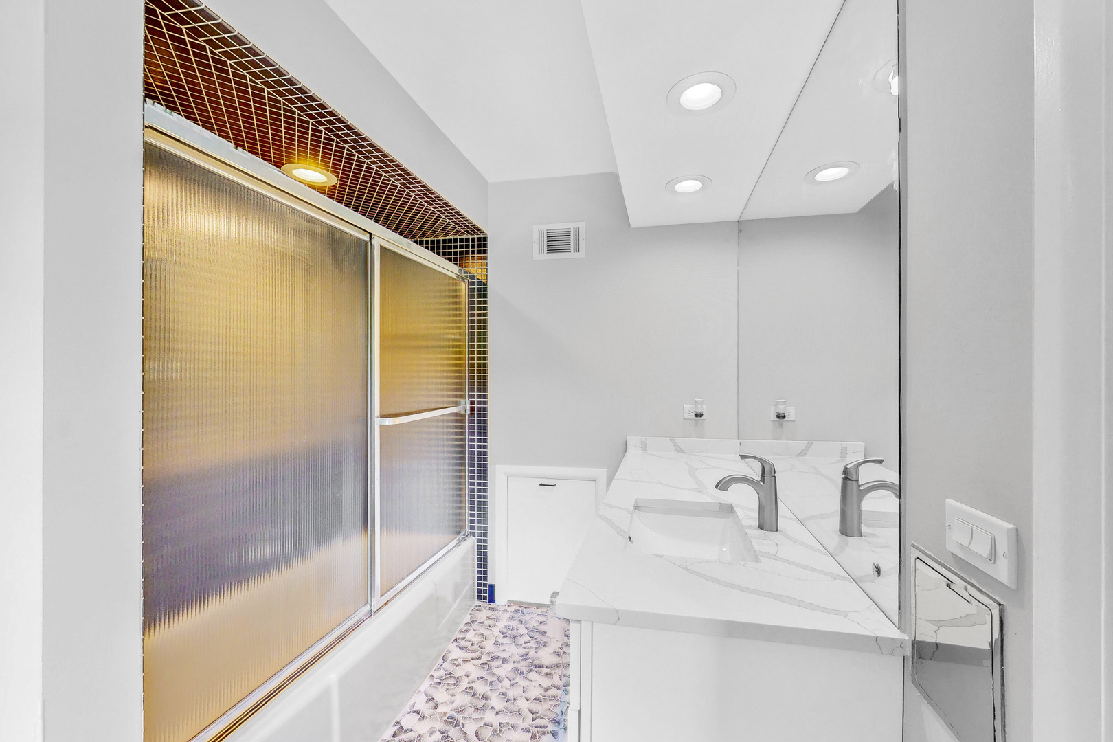 2100 Burr Oak Drive Glenview, IL 60025 - Photo 23 of 38 a bathroom with a bathtub and a shower