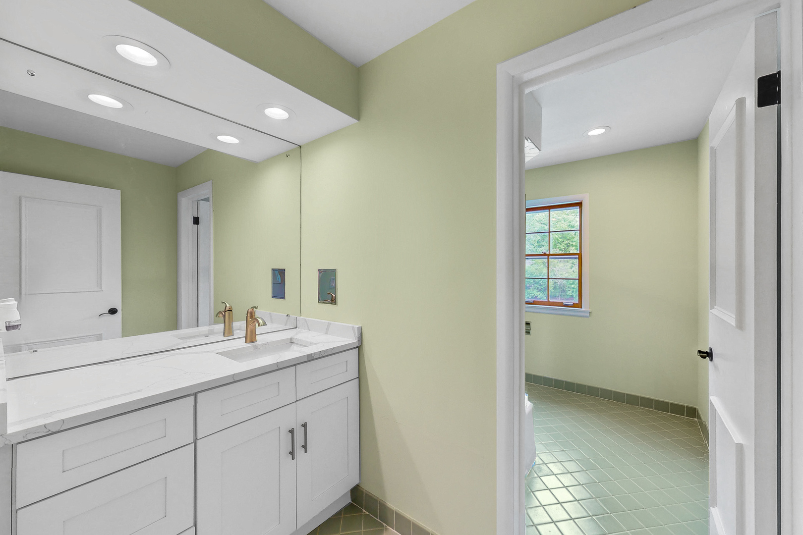 2100 Burr Oak Drive Glenview, IL 60025 - Photo 24 of 38 a bathroom with a sink and a mirror