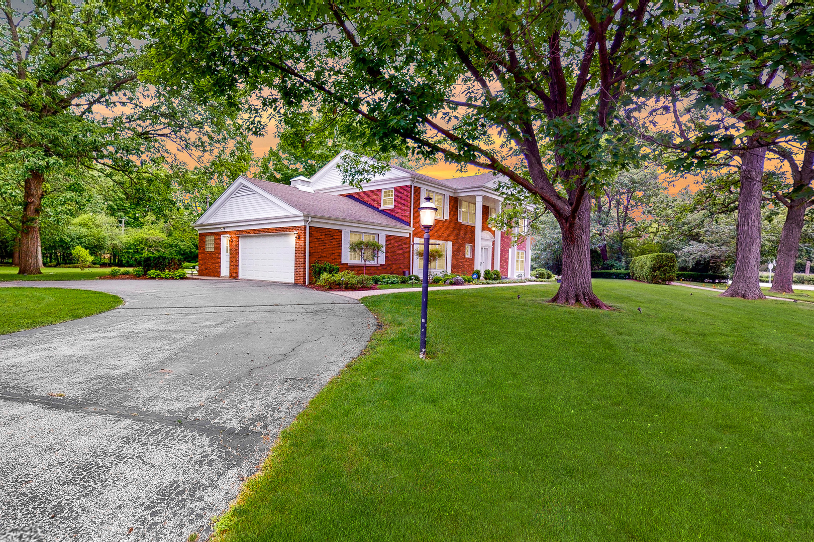 2100 Burr Oak Drive Glenview, IL 60025 - Photo 3 of 38 a front view of a house with a yard