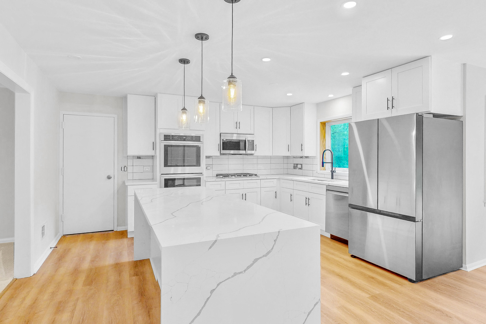 2100 Burr Oak Drive Glenview, IL 60025 - Photo 7 of 38 a kitchen with stainless steel appliances a refrigerator sink and microwave