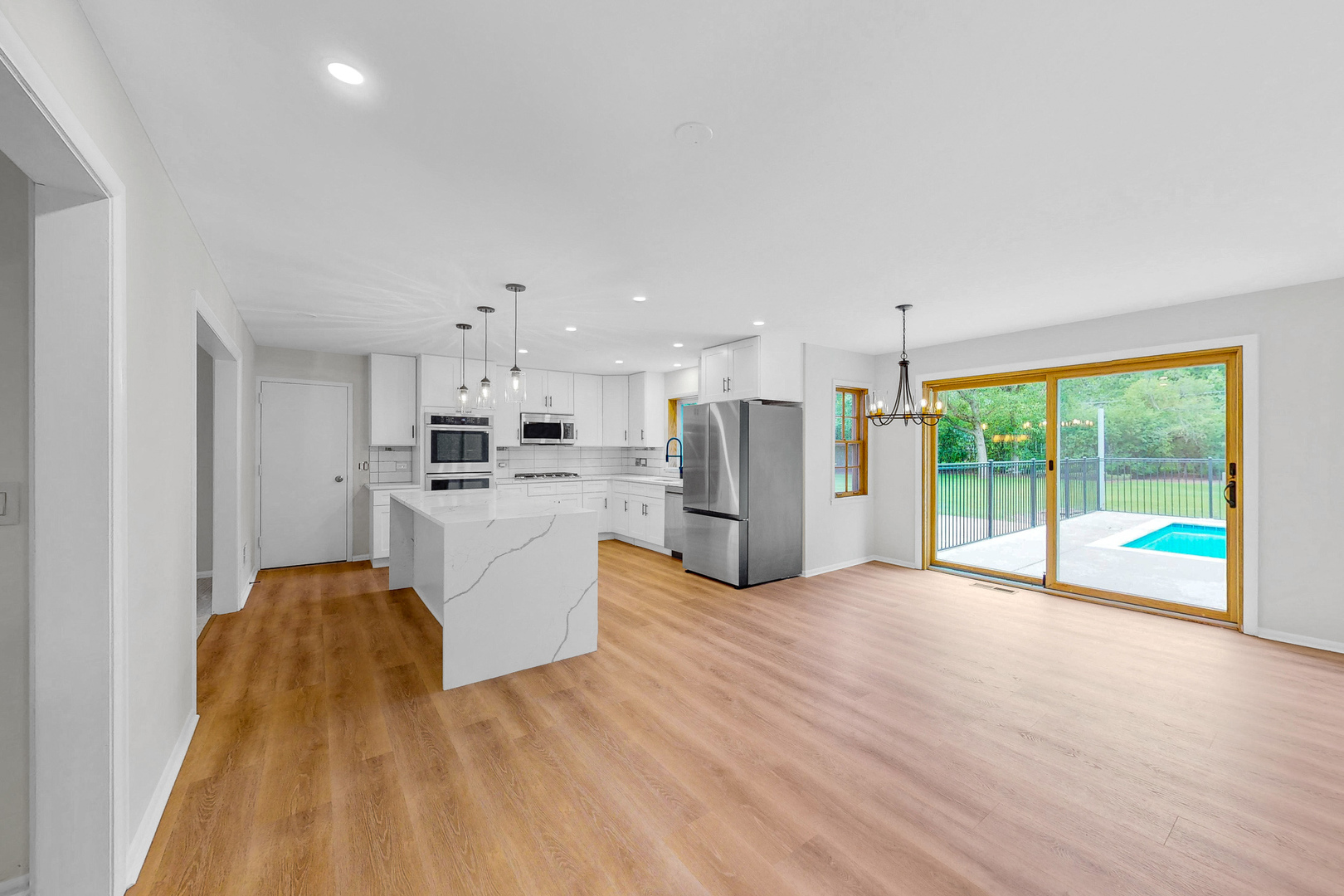 2100 Burr Oak Drive Glenview, IL 60025 - Photo 10 of 38 a kitchen with a sink a counter top space stainless steel appliances and cabinets