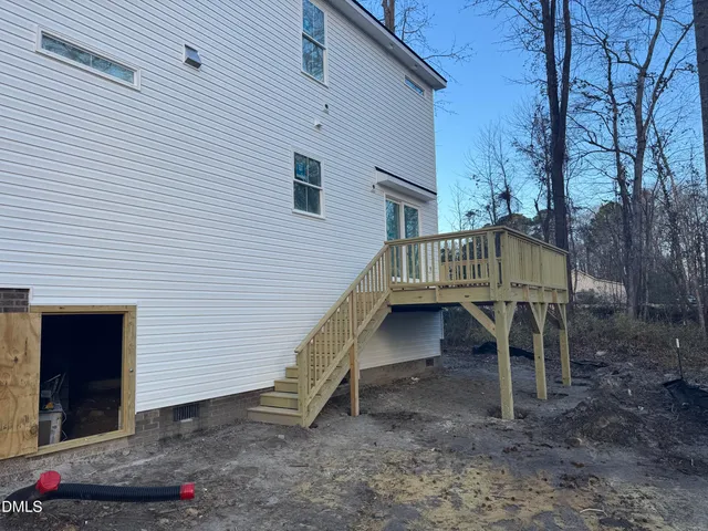 a view of a house with a yard and garage