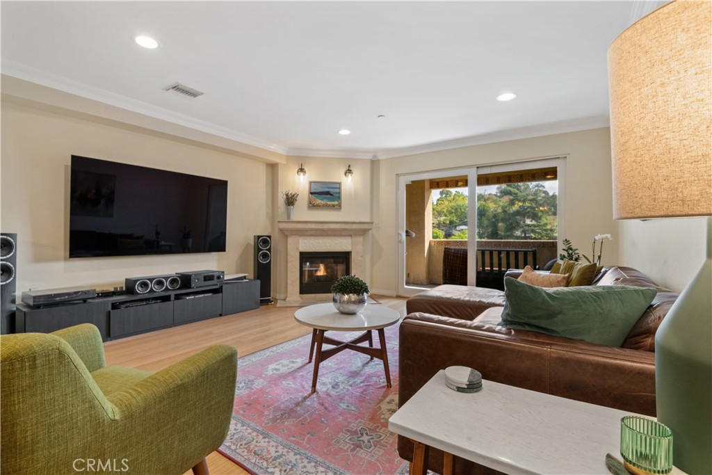 6221 Monterey Road, Unit 304 Highland Park, CA 90042 - Photo 12 of 27 a living room with furniture a flat screen tv and a large window