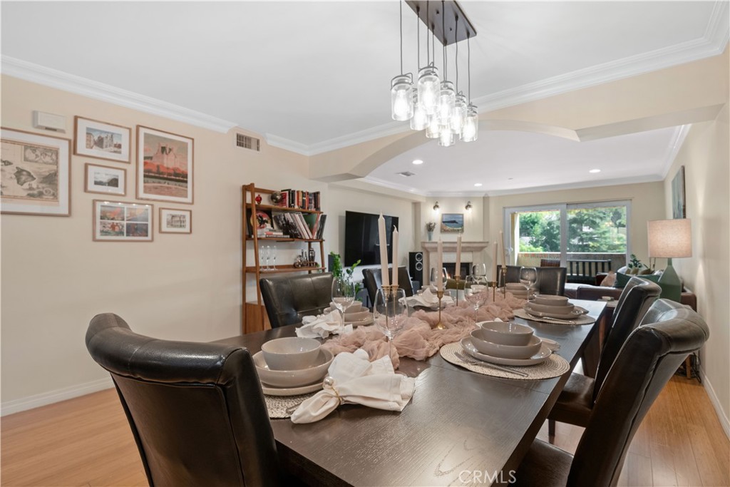 6221 Monterey Road, Unit 304 Highland Park, CA 90042 - Photo 13 of 27 a view of a dining room with furniture and chandelier