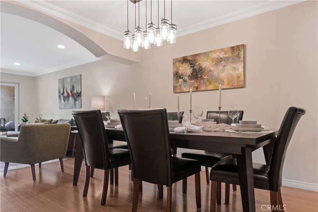 6221 Monterey Road, Unit 304 Highland Park, CA 90042 - Photo 14 of 27 a view of a dining room with furniture and chandelier