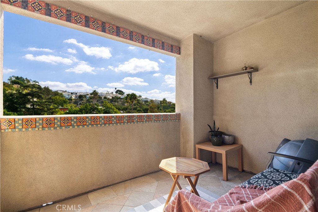 6221 Monterey Road, Unit 304 Highland Park, CA 90042 - Photo 15 of 27 a view of a balcony with chairs