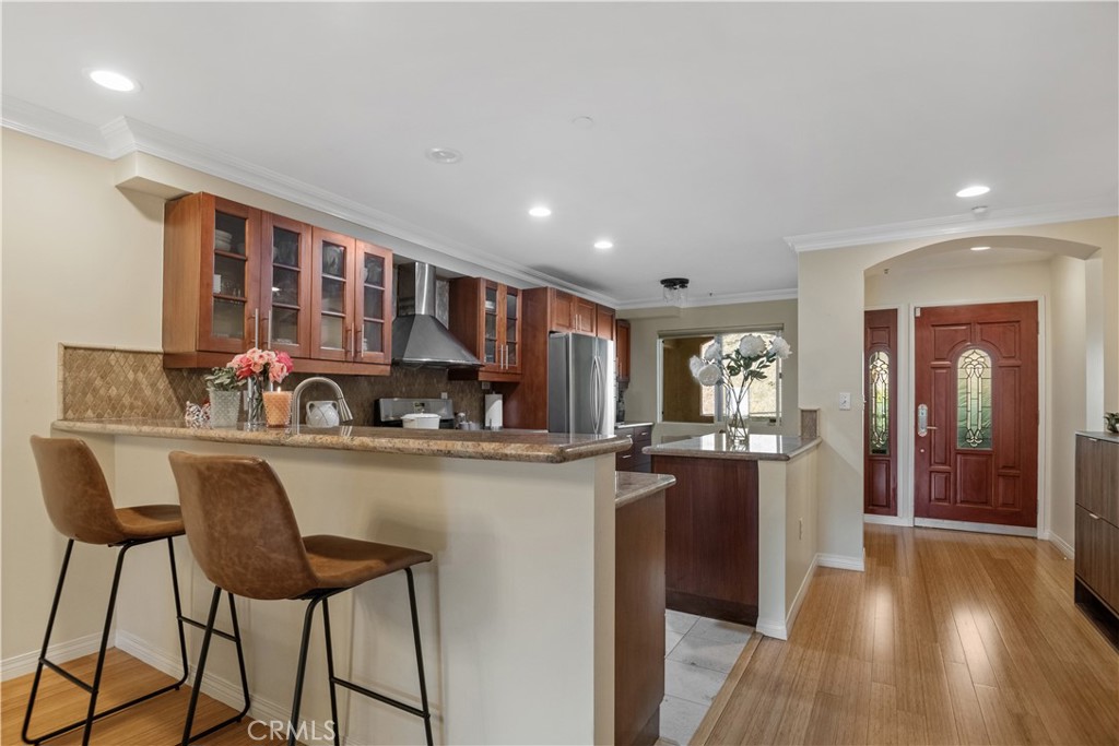 6221 Monterey Road, Unit 304 Highland Park, CA 90042 - Photo 5 of 27 a kitchen with stainless steel appliances granite countertop a refrigerator and a stove top oven
