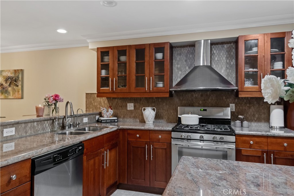 6221 Monterey Road, Unit 304 Highland Park, CA 90042 - Photo 9 of 27 a kitchen with stainless steel appliances granite countertop a sink stove and cabinets