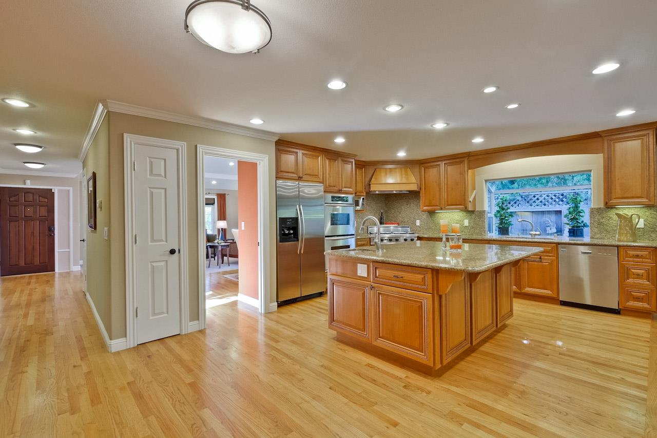 1229 Rousseau Drive Sunnyvale, CA 94087 - Photo 11 of 37 a large kitchen with stainless steel appliances granite countertop a large counter top and wooden floors