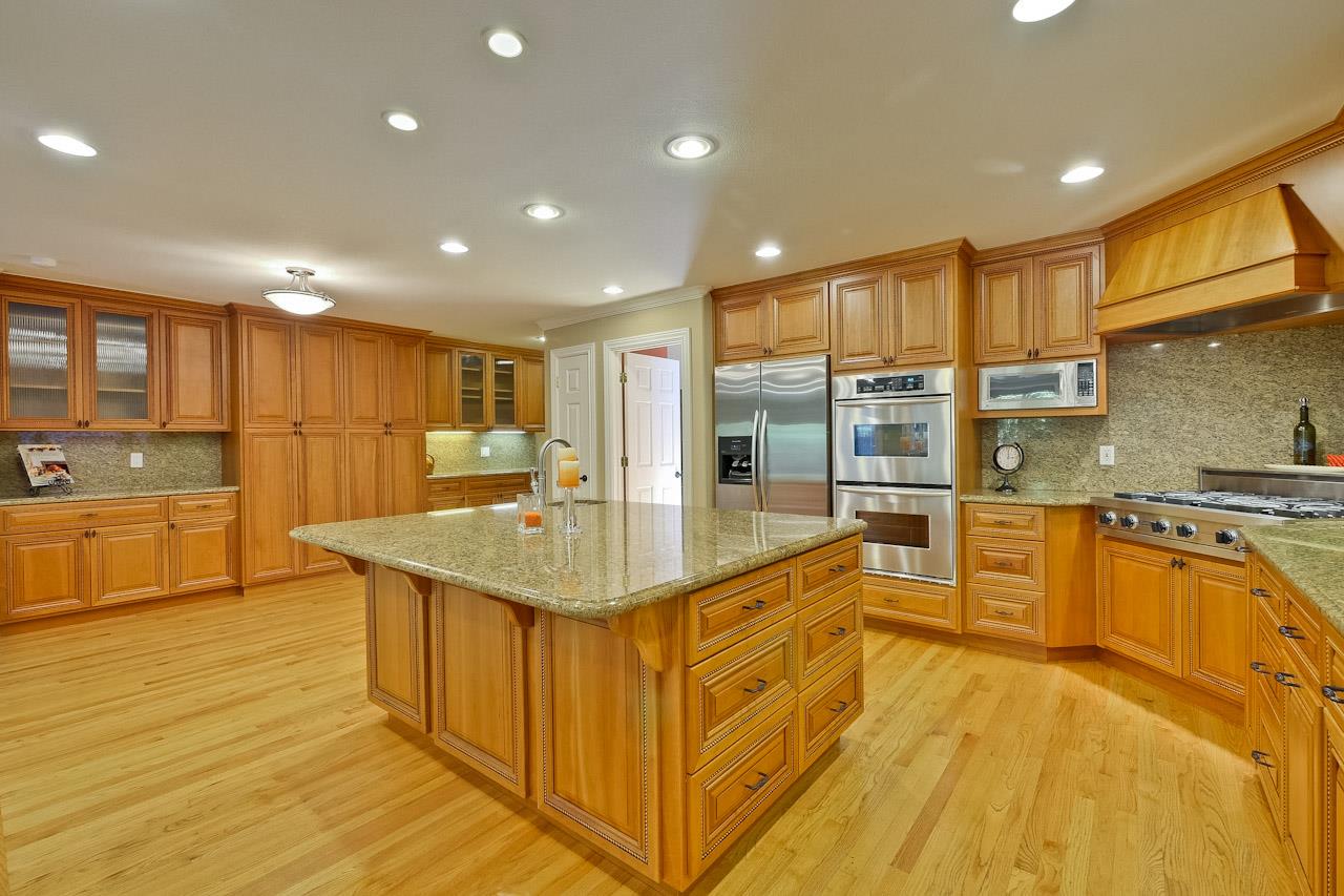 1229 Rousseau Drive Sunnyvale, CA 94087 - Photo 12 of 37 a kitchen with stainless steel appliances granite countertop a sink and cabinets