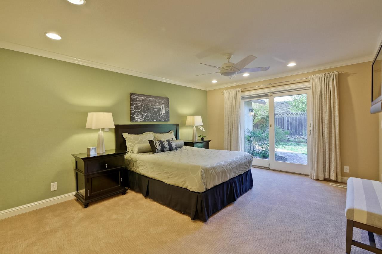 1229 Rousseau Drive Sunnyvale, CA 94087 - Photo 22 of 37 a spacious bedroom with a bed and large window