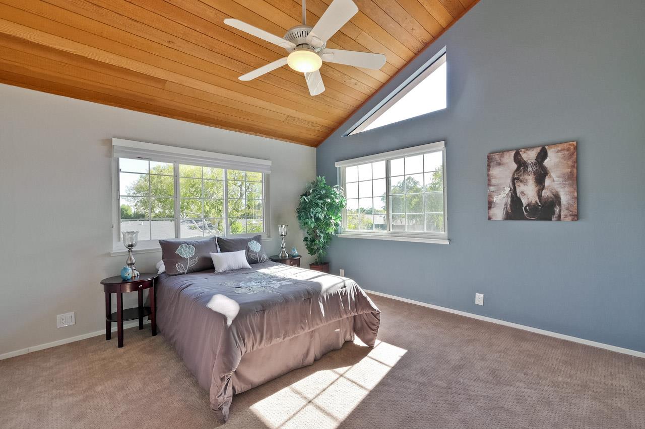 1229 Rousseau Drive Sunnyvale, CA 94087 - Photo 27 of 37 a bedroom with a bed wooden floor and window