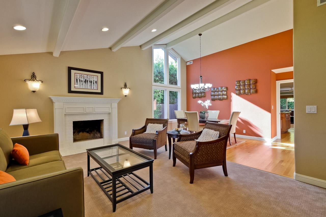 1229 Rousseau Drive Sunnyvale, CA 94087 - Photo 3 of 37 a living room with furniture a dining table and a fireplace