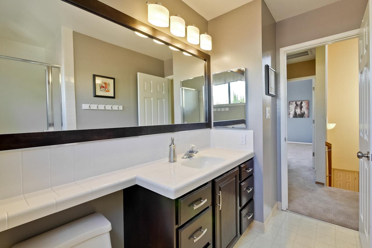 1229 Rousseau Drive Sunnyvale, CA 94087 - Photo 31 of 37 a bathroom with a sink and a mirror