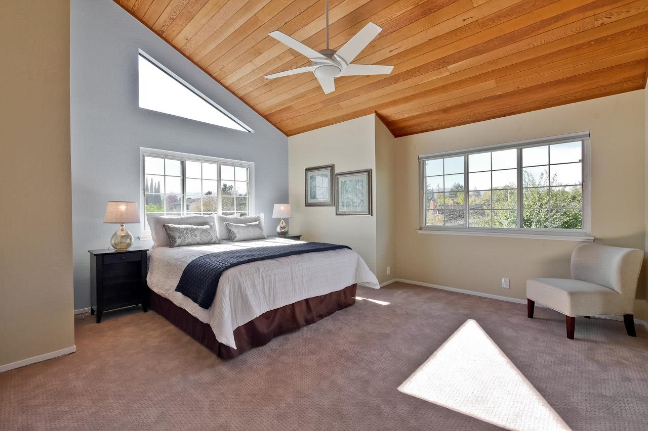 1229 Rousseau Drive Sunnyvale, CA 94087 - Photo 32 of 37 a spacious bedroom with a bed and a large window