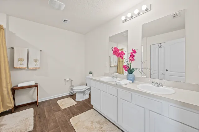 a view of walk in closet with clothes