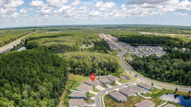 a view of sign board with a yard