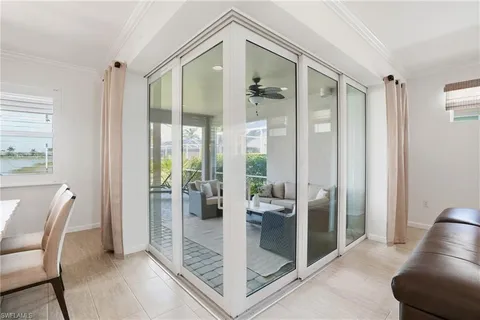 a bathroom with a glass shower door and a glass door