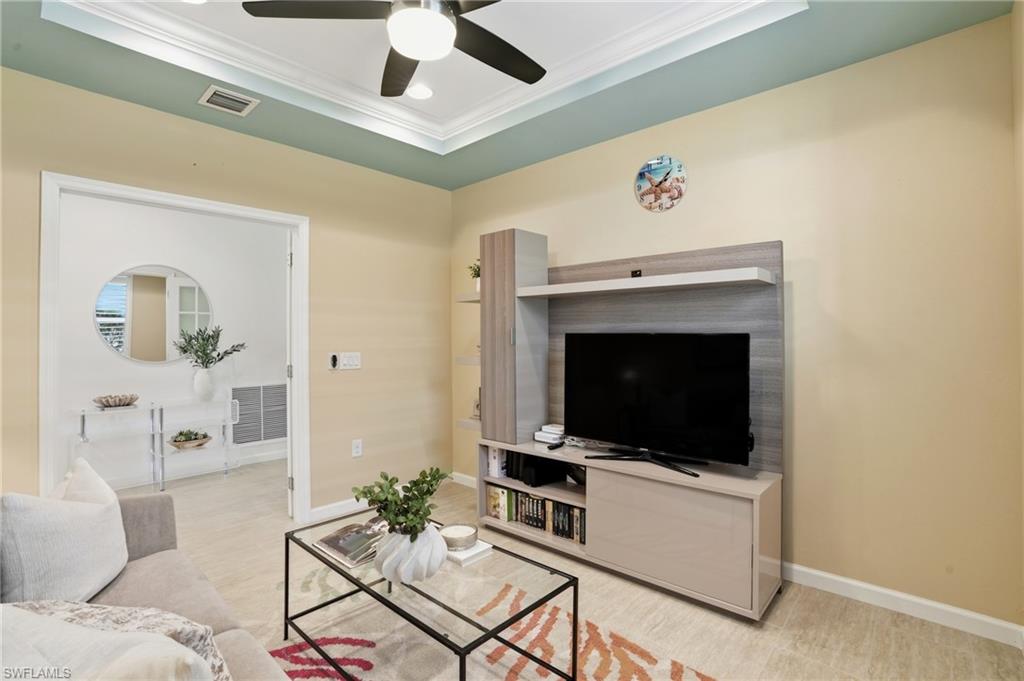 10520 Tidewater Key Boulevard Estero, FL 33928 - Photo 15 of 50 a living room with furniture and a fireplace