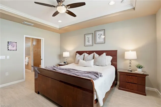 a bedroom with bed and window