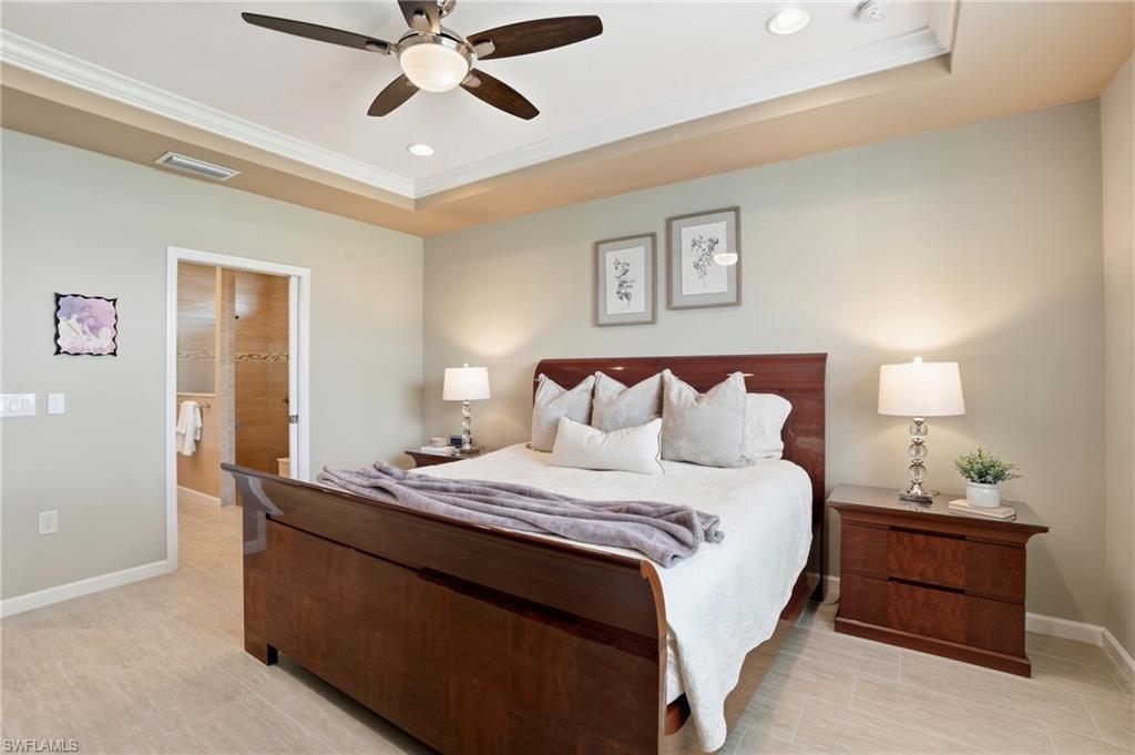 10520 Tidewater Key Boulevard Estero, FL 33928 - Photo 18 of 50 a bedroom with bed and window