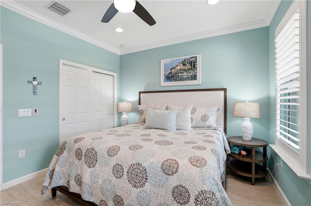 10520 Tidewater Key Boulevard Estero, FL 33928 - Photo 22 of 50 a bedroom with a large bed and a window