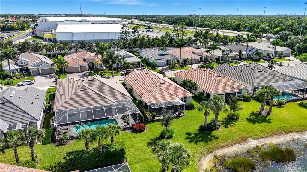10520 Tidewater Key Boulevard Estero, FL 33928 - Photo 33 of 50 an aerial view of multiple houses with a yard