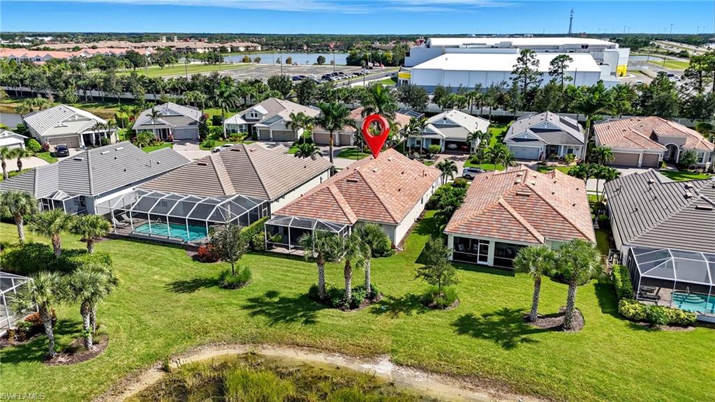 10520 Tidewater Key Boulevard Estero, FL 33928 - Photo 35 of 50 a aerial view of a house with a garden