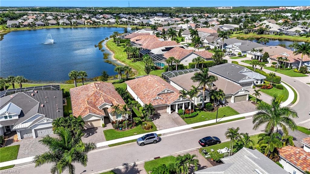 10520 Tidewater Key Boulevard Estero, FL 33928 - Photo 36 of 50 an aerial view of a house with a swimming pool yard and outdoor seating