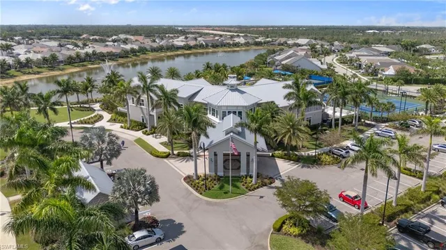an aerial view of a house with a lake view