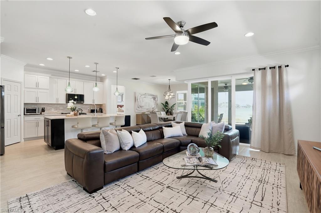 10520 Tidewater Key Boulevard Estero, FL 33928 - Photo 5 of 50 a living room with furniture kitchen and a chandelier