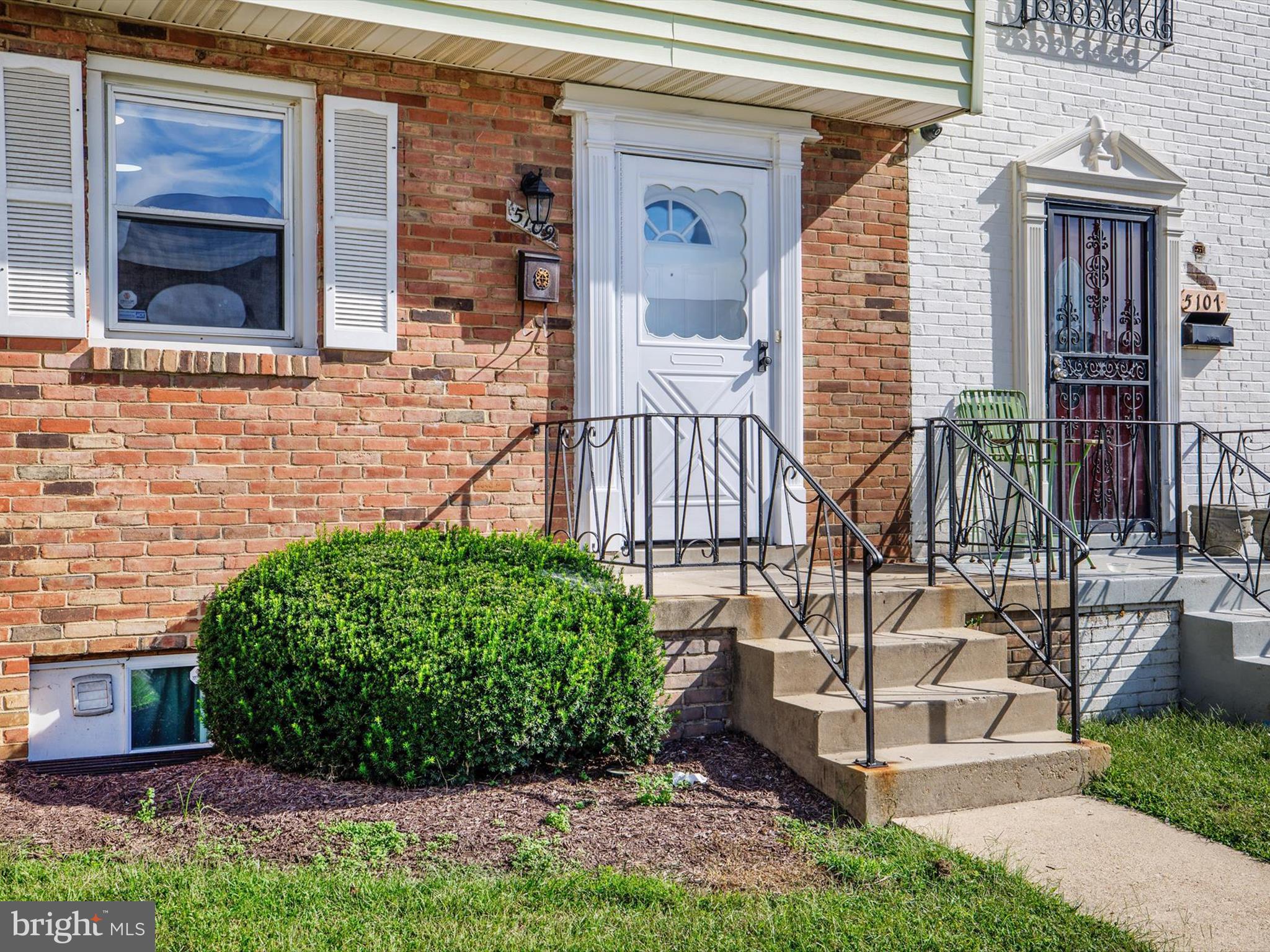 5109 Clacton Avenue, Unit 78 Suitland, MD 20746 - Photo 2 of 33 a front view of a house with a yard