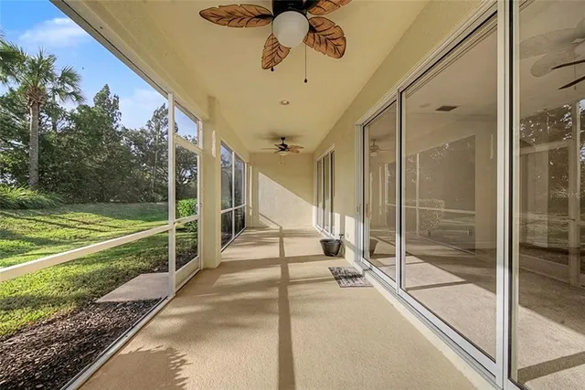 a view of an entryway with a glass door and chandelier