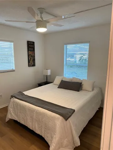 a bedroom with bed and window