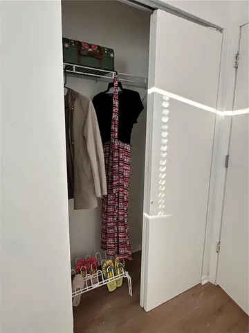 a bedroom with a bed and a chair