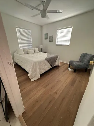 a kitchen with a sink a stove cabinets and a dining table
