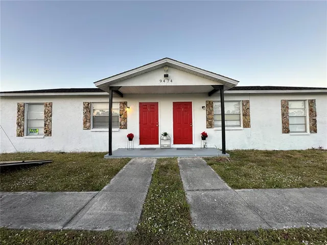 a front view of a house with yard