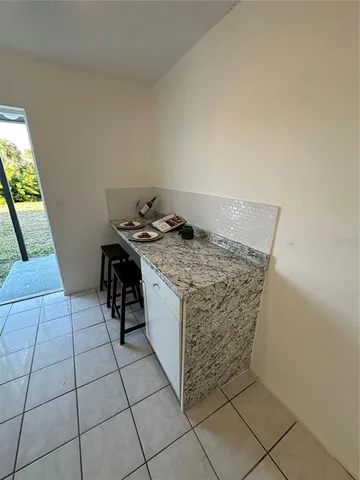 a kitchen with stainless steel appliances a sink stove and cabinets