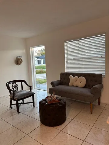 a living room with furniture and a window