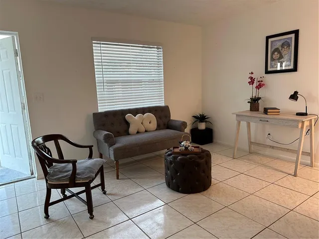 a view of a livingroom with furniture and a flat screen tv